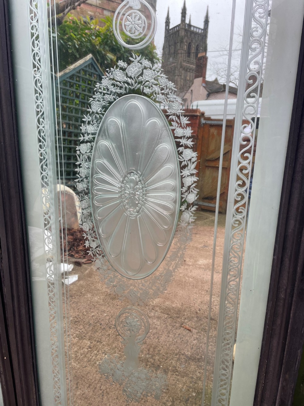 A pair of tall rectangular Edwardian wall mirrors featuring detailed etched floral urns and central oval medallions in dark wooden frames. View VIII