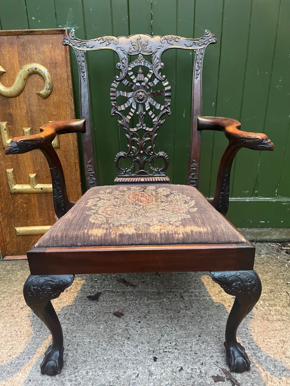 A late 19th-century carved mahogany armchair featuring carved eagle-head armrests, a pierced ribbon splat back, floral tapestry upholstery, and cabriole legs with claw-and-ball feet. View II