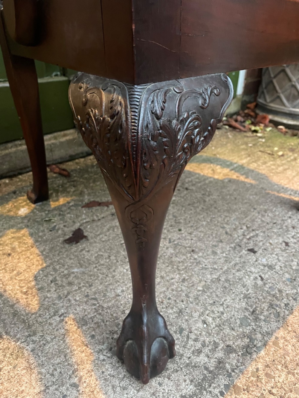 A late 19th-century carved mahogany armchair featuring carved eagle-head armrests, a pierced ribbon splat back, floral tapestry upholstery, and cabriole legs with claw-and-ball feet. View VI
