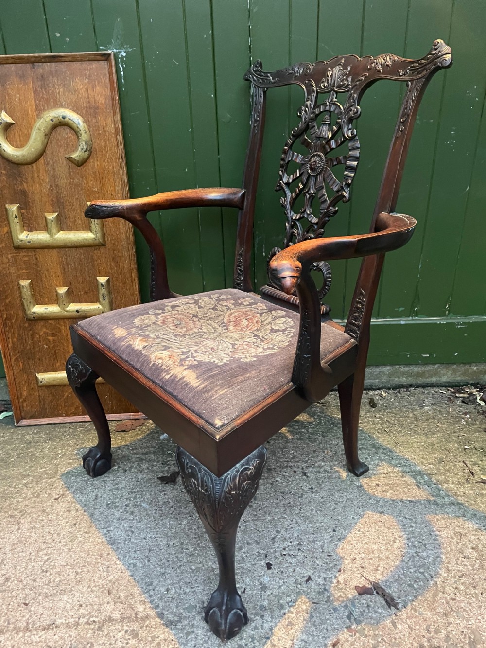 A late 19th-century carved mahogany armchair featuring carved eagle-head armrests, a pierced ribbon splat back, floral tapestry upholstery, and cabriole legs with claw-and-ball feet. View VIII