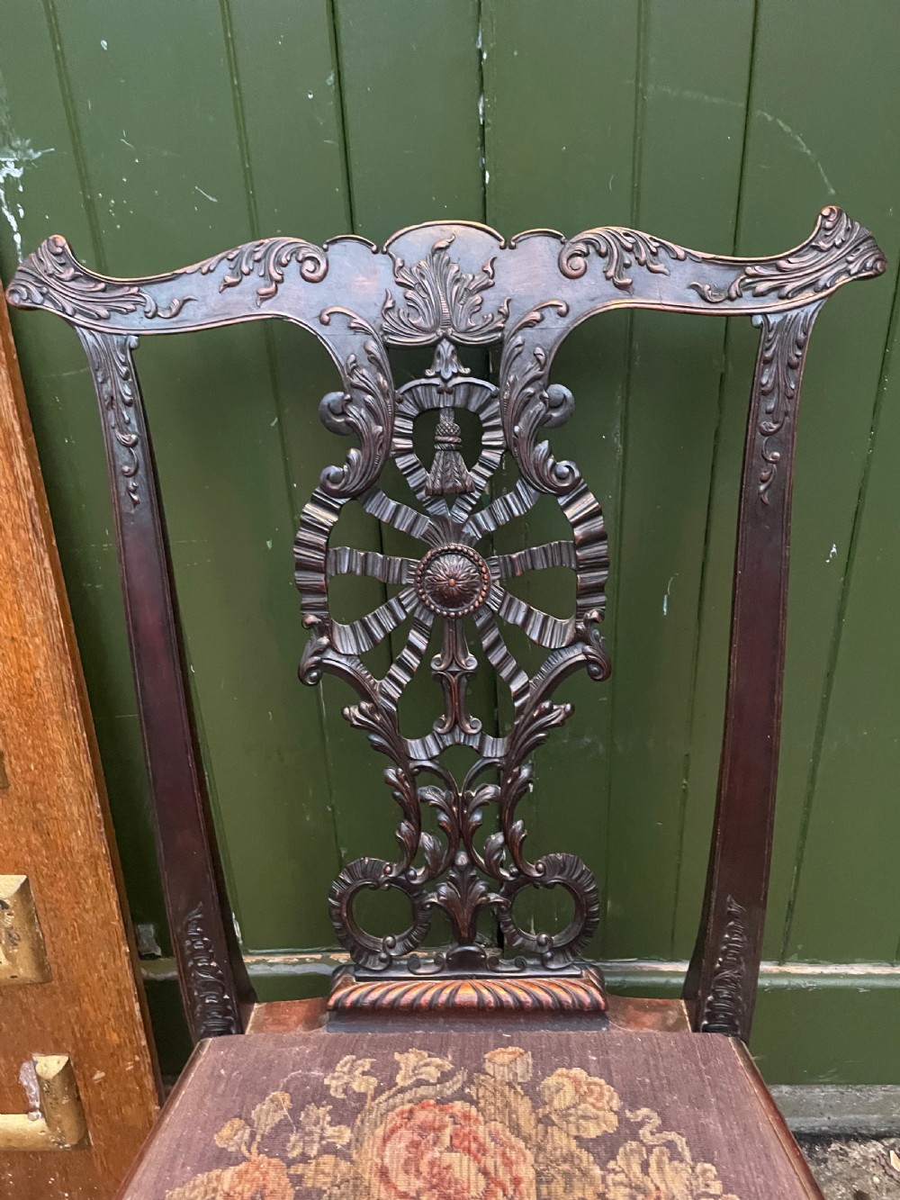 A late 19th-century carved mahogany armchair featuring carved eagle-head armrests, a pierced ribbon splat back, floral tapestry upholstery, and cabriole legs with claw-and-ball feet. View XI
