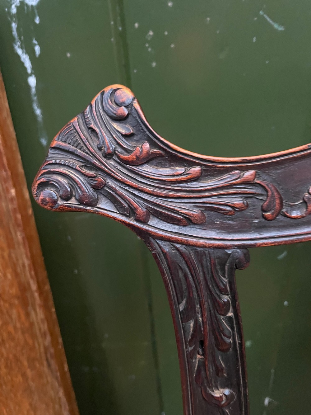 A late 19th-century carved mahogany armchair featuring carved eagle-head armrests, a pierced ribbon splat back, floral tapestry upholstery, and cabriole legs with claw-and-ball feet. View XII