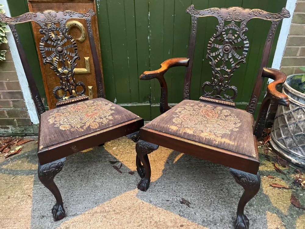 A late 19th-century carved mahogany armchair featuring carved eagle-head armrests, a pierced ribbon splat back, floral tapestry upholstery, and cabriole legs with claw-and-ball feet. View XV