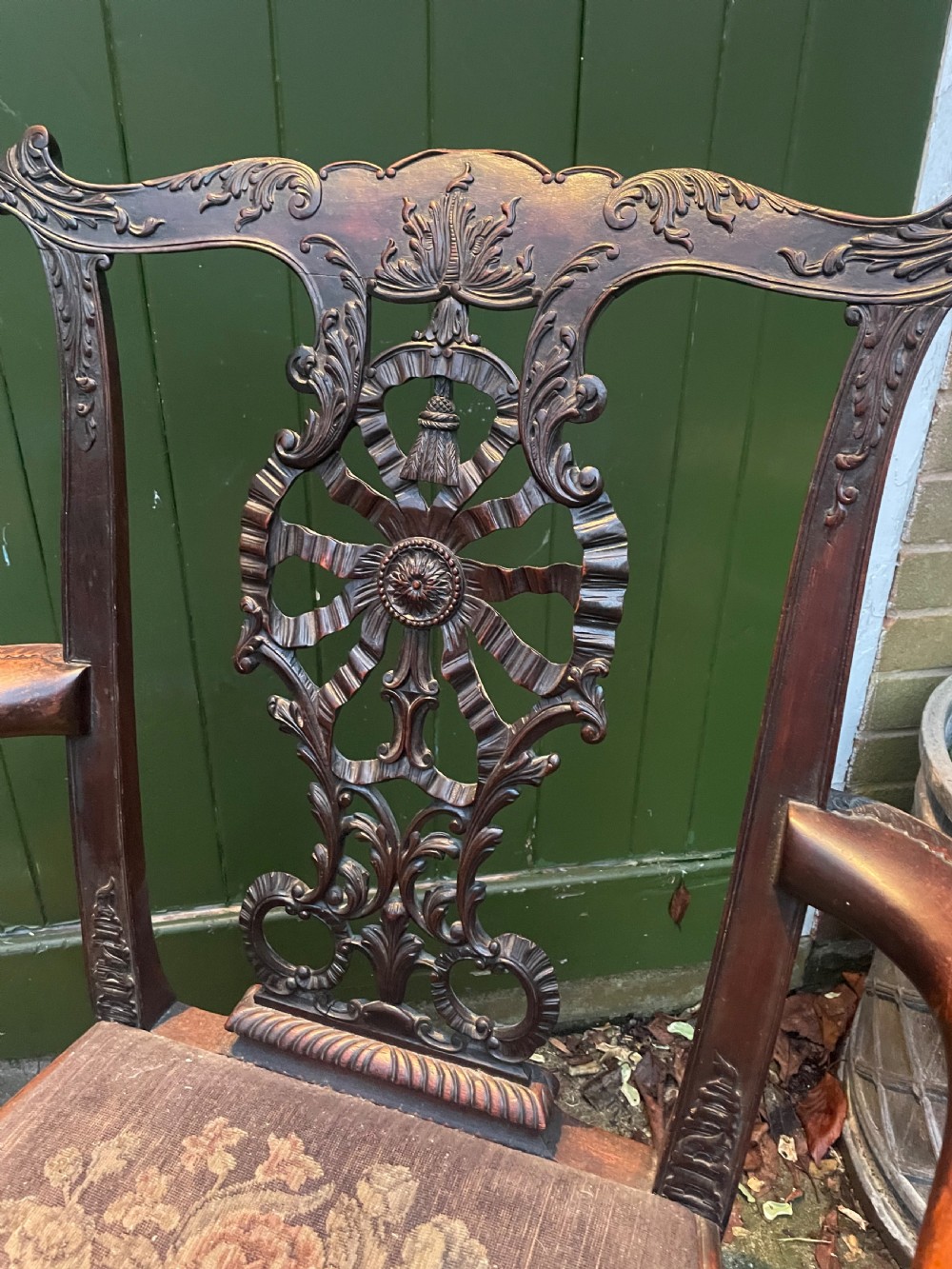 A late 19th-century carved mahogany armchair featuring carved eagle-head armrests, a pierced ribbon splat back, floral tapestry upholstery, and cabriole legs with claw-and-ball feet. View XVI