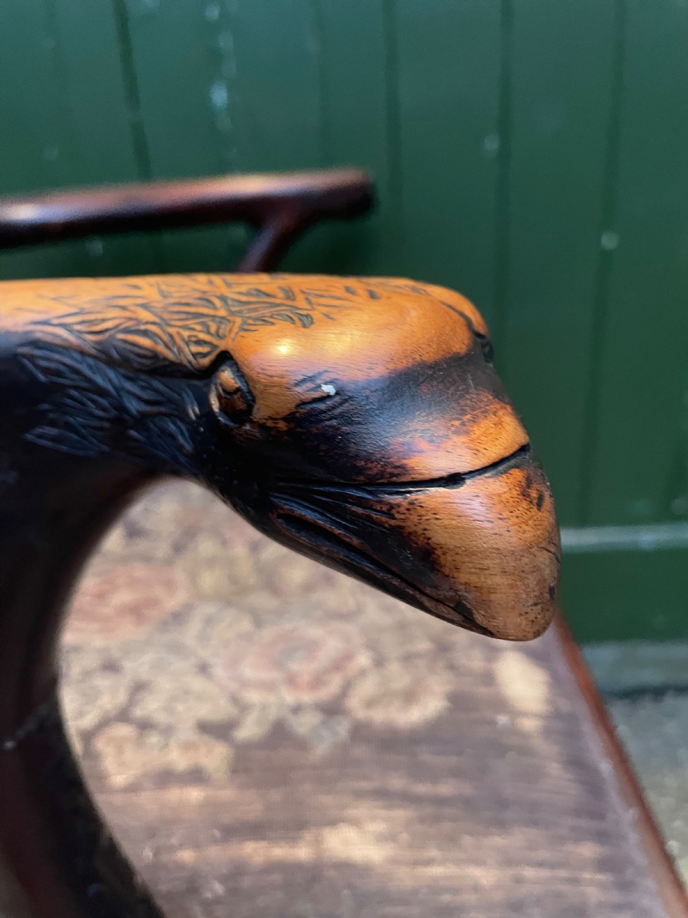 A late 19th-century carved mahogany armchair featuring carved eagle-head armrests, a pierced ribbon splat back, floral tapestry upholstery, and cabriole legs with claw-and-ball feet. View XX