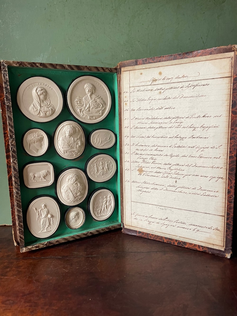 Mid C19th Italian ‘Grand Tour’ souvenir double-sided faux book containing a selection of various plaster intaglios by Paoletti. View II