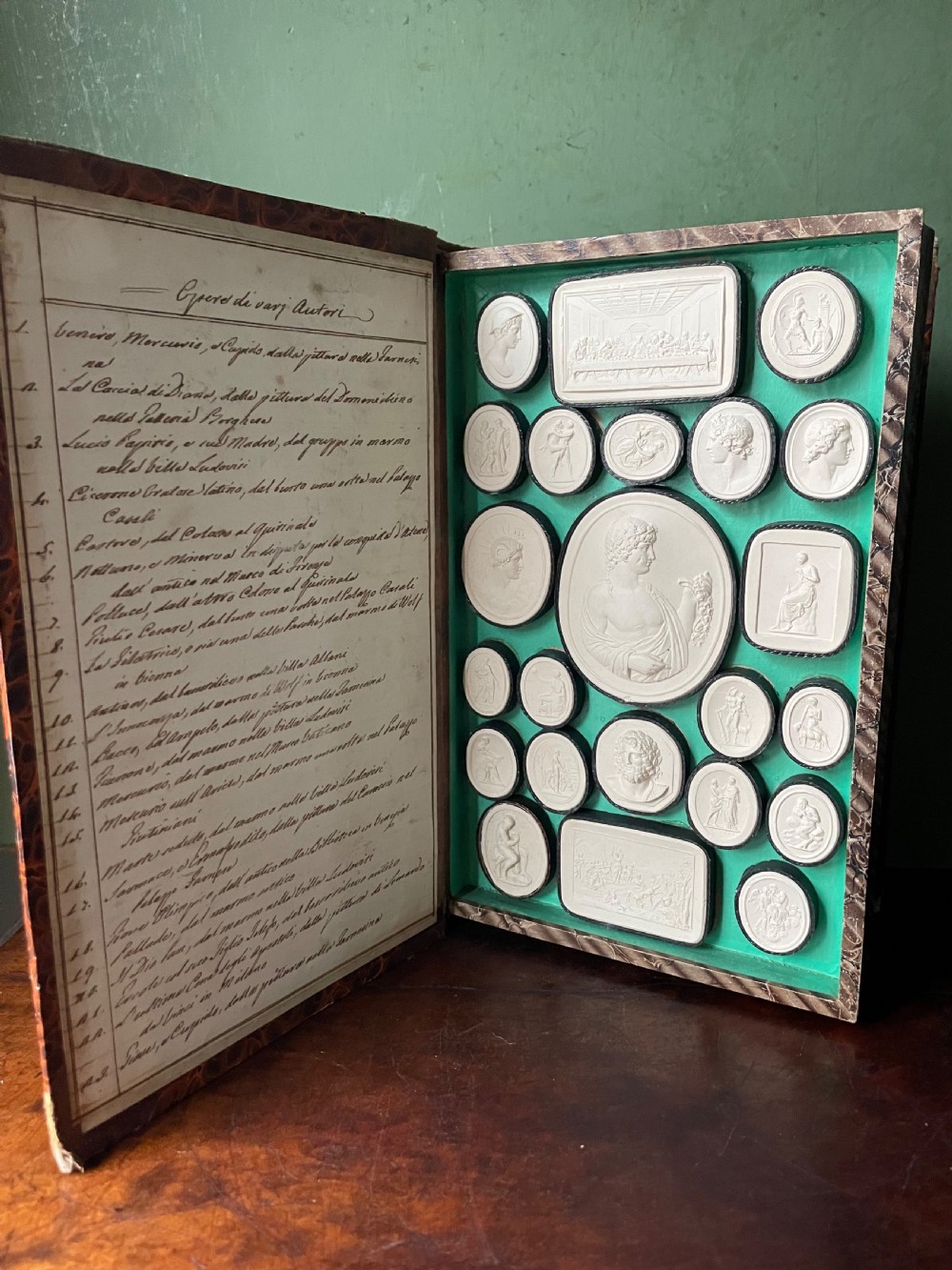 Mid C19th Italian ‘Grand Tour’ souvenir double-sided faux book containing a selection of various plaster intaglios by Paoletti. View VII