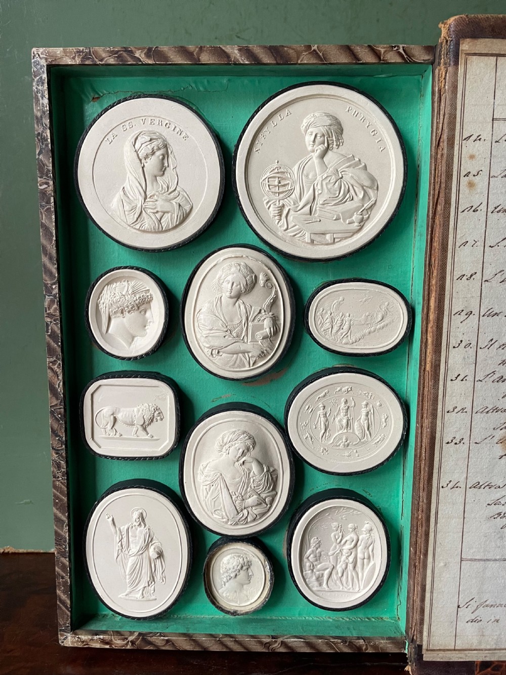 Mid C19th Italian ‘Grand Tour’ souvenir double-sided faux book containing a selection of various plaster intaglios by Paoletti. View XII