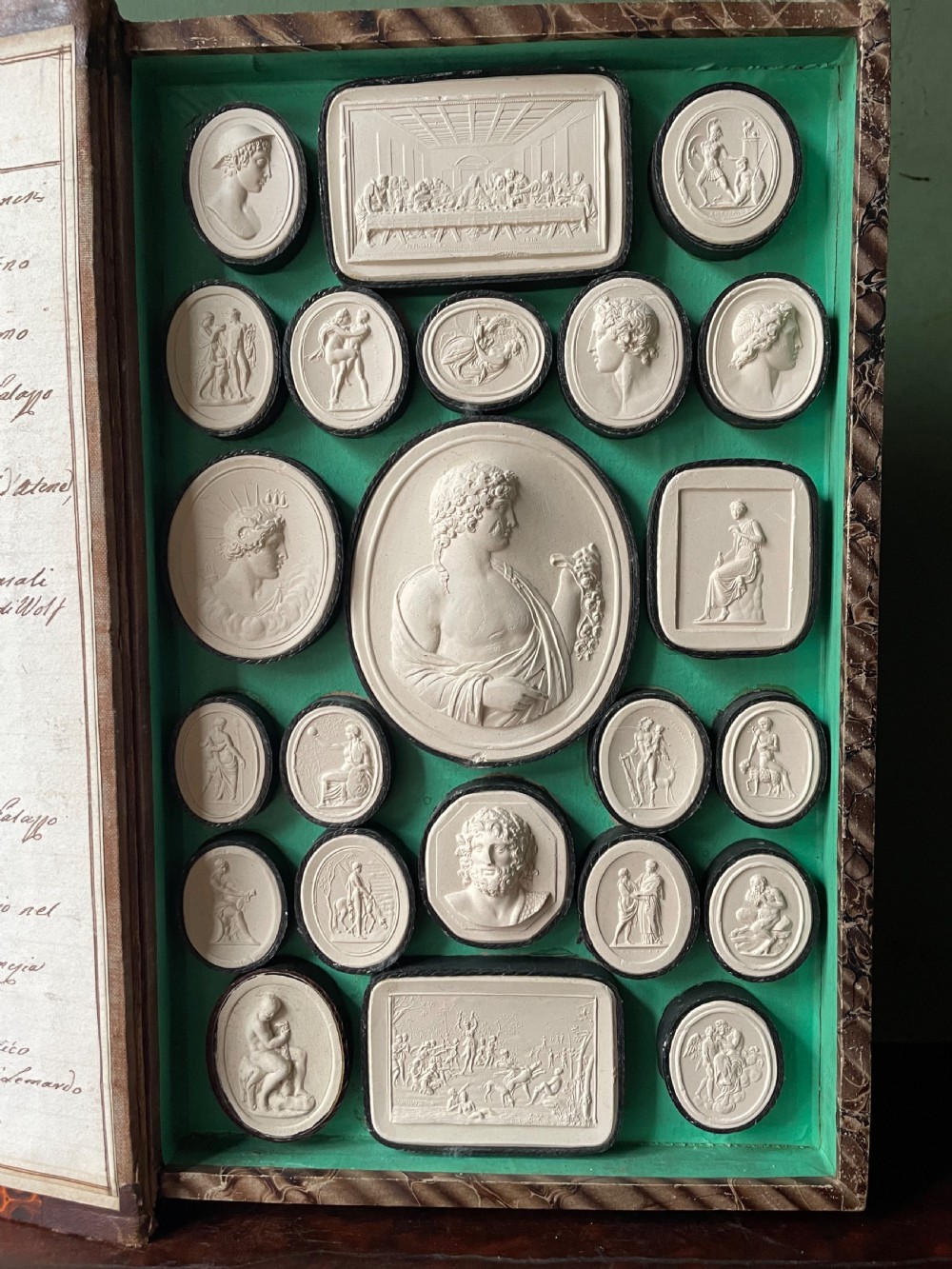 Mid C19th Italian ‘Grand Tour’ souvenir double-sided faux book containing a selection of various plaster intaglios by Paoletti. View XVI