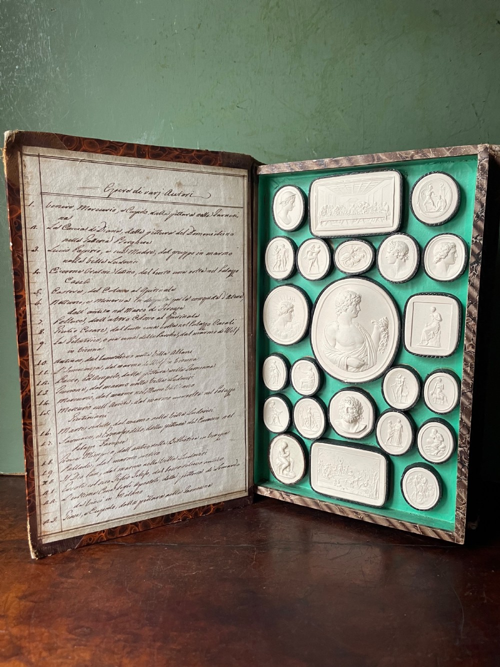 Mid C19th Italian ‘Grand Tour’ souvenir double-sided faux book containing a selection of various plaster intaglios by Paoletti. View XVII