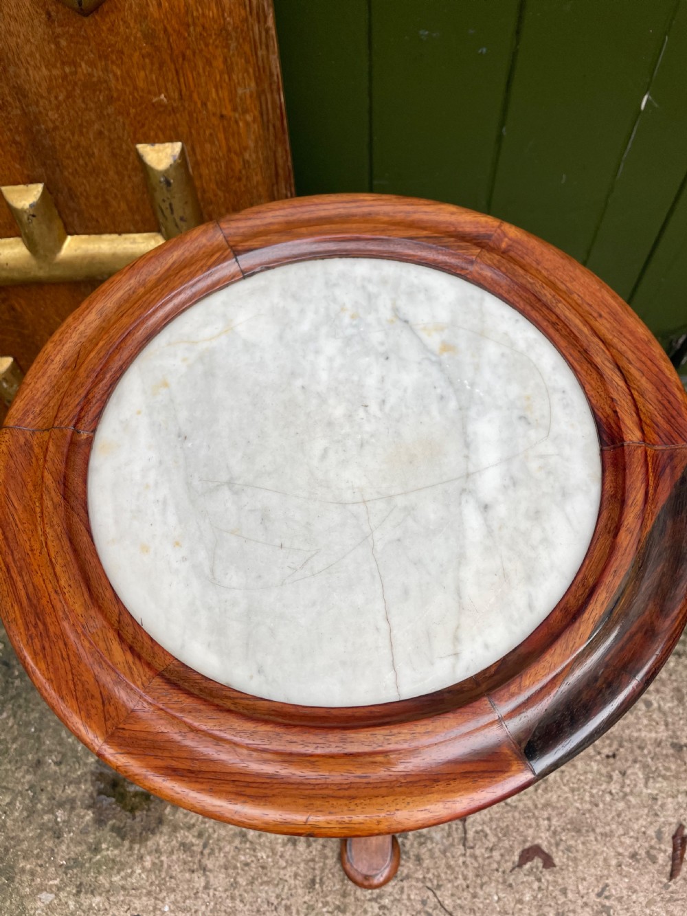 An early 19th-century George IV occasional table featuring a circular top with an inset marble panel, a faceted rosewood column, and a triform base. View V