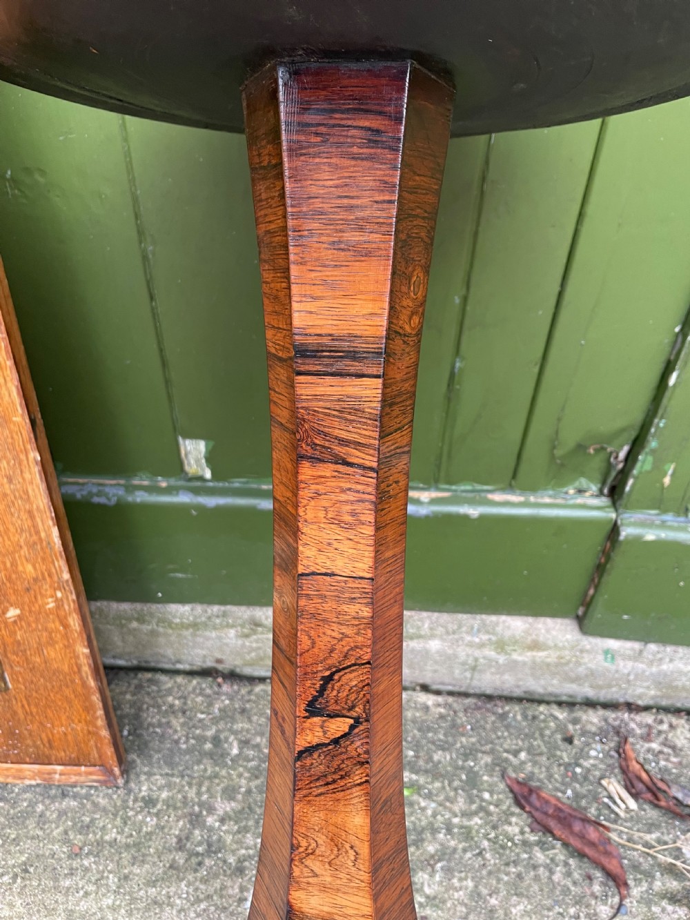 An early 19th-century George IV occasional table featuring a circular top with an inset marble panel, a faceted rosewood column, and a triform base. View XII