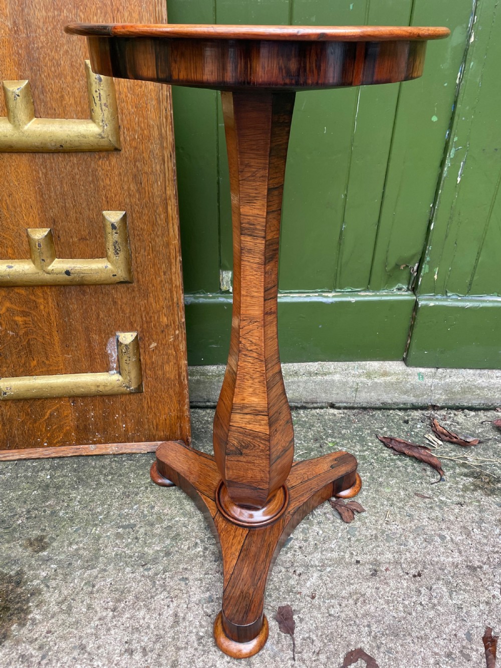 An early 19th-century George IV occasional table featuring a circular top with an inset marble panel, a faceted rosewood column, and a triform base. View XIII