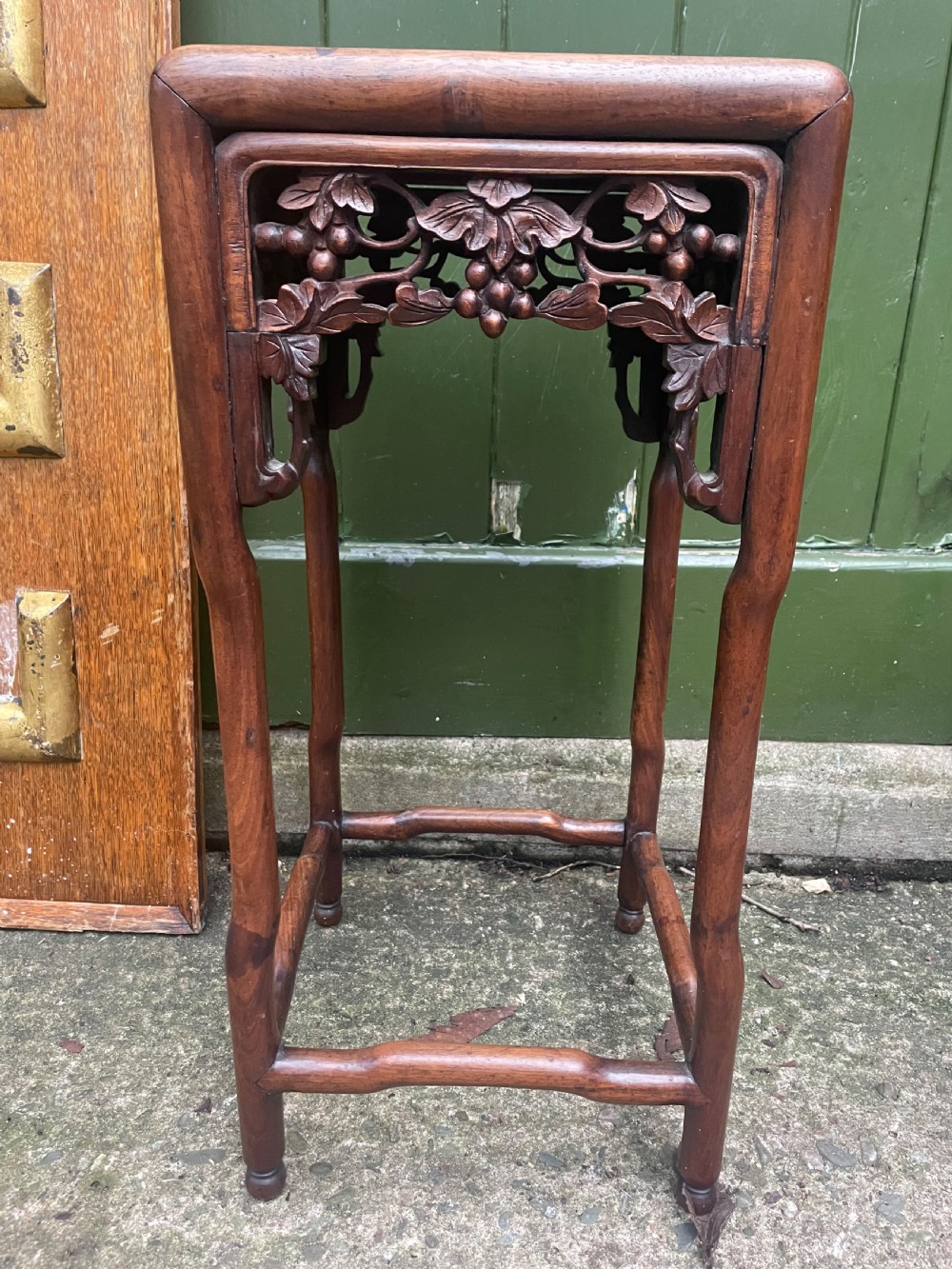 A pair of late nineteenth to early twentieth century Chinese Qing Dynasty carved huali hardwood side tables featuring openwork grapevine aprons and organic faux-bamboo legs. View VII