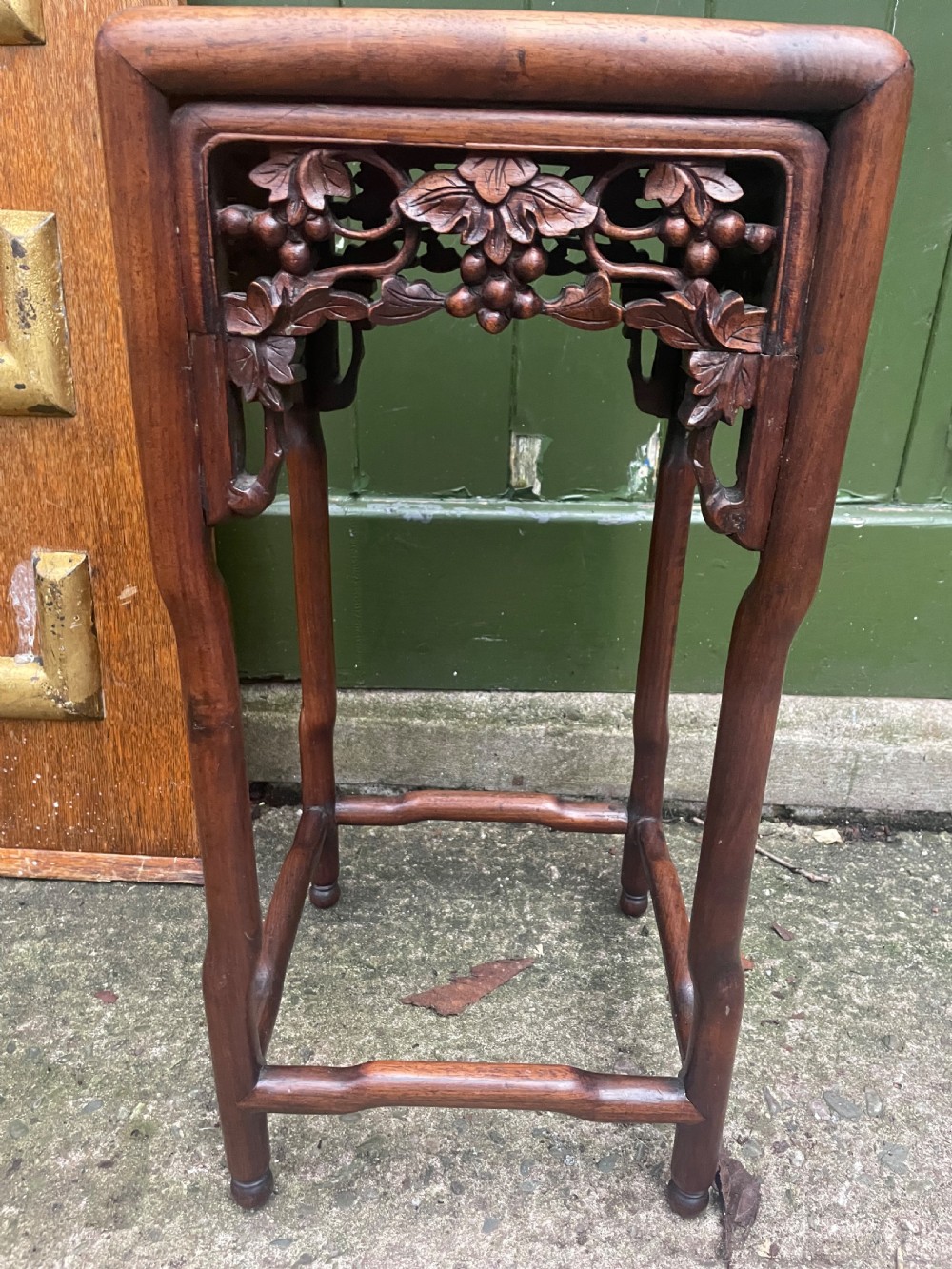 A pair of late nineteenth to early twentieth century Chinese Qing Dynasty carved huali hardwood side tables featuring openwork grapevine aprons and organic faux-bamboo legs. View VIII