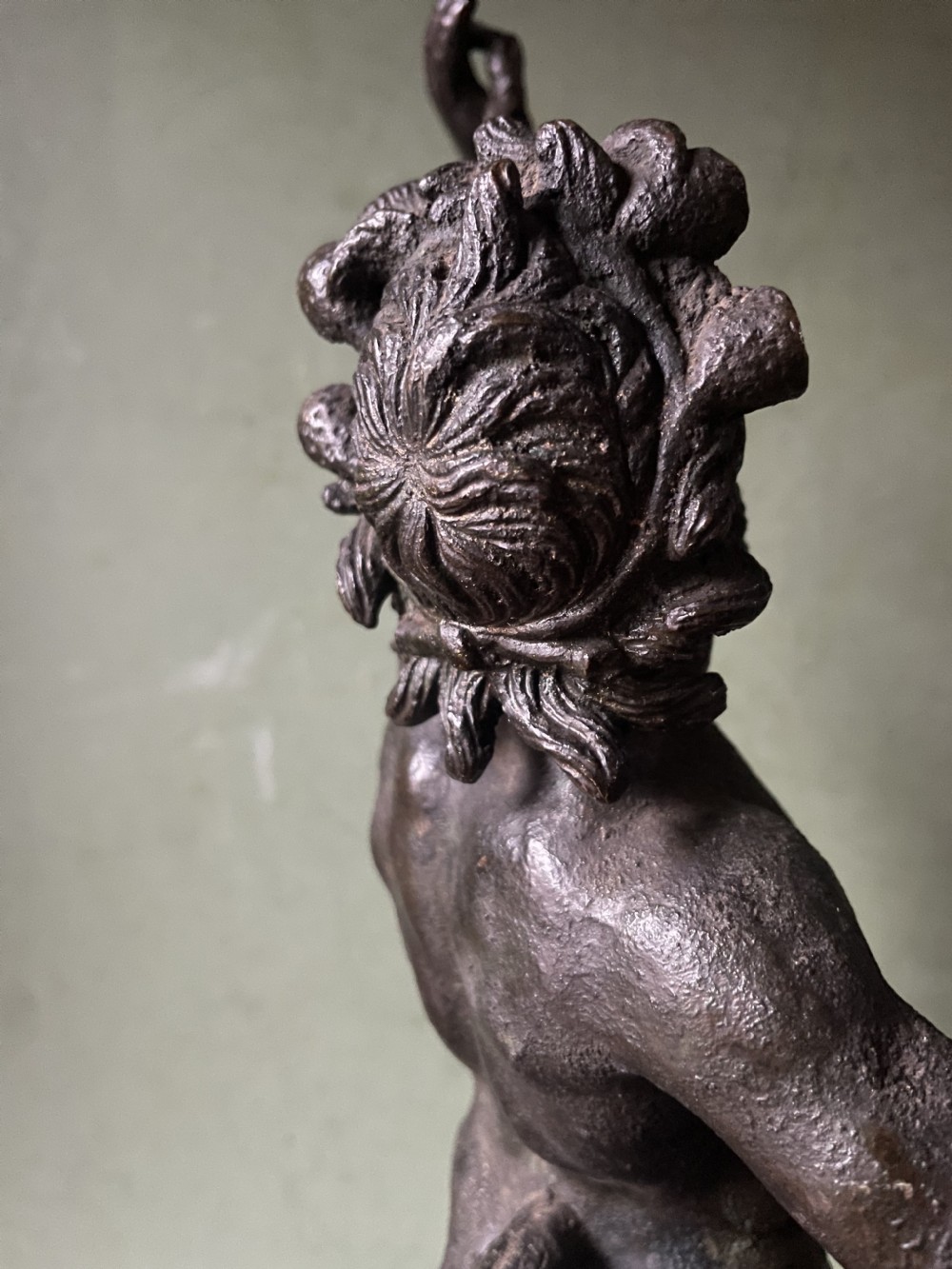 A late nineteenth-century dark patinated bronze sculpture depicting the Dancing Faun of Pompeii standing in a dynamic pose on a rectangular bronze base. View XV