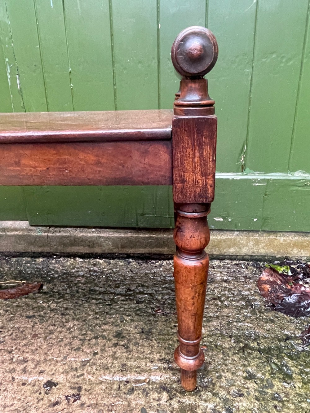 Early C19th Regency period mahogany hall bench or seat with cylindrical roll-end supports. View IV