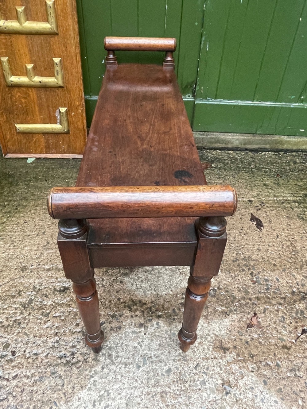 Early C19th Regency period mahogany hall bench or seat with cylindrical roll-end supports. View V