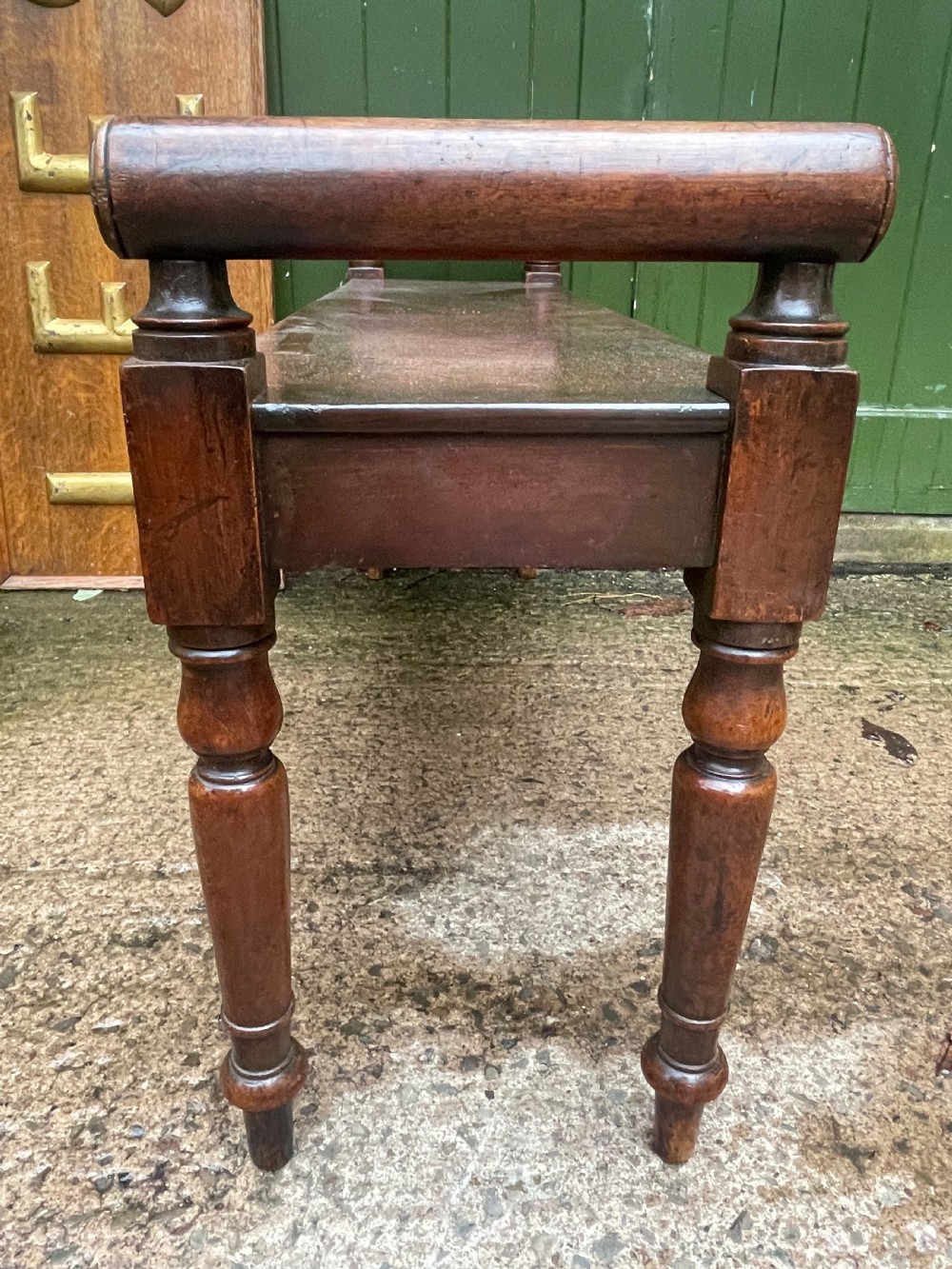 Early C19th Regency period mahogany hall bench or seat with cylindrical roll-end supports. View VIII