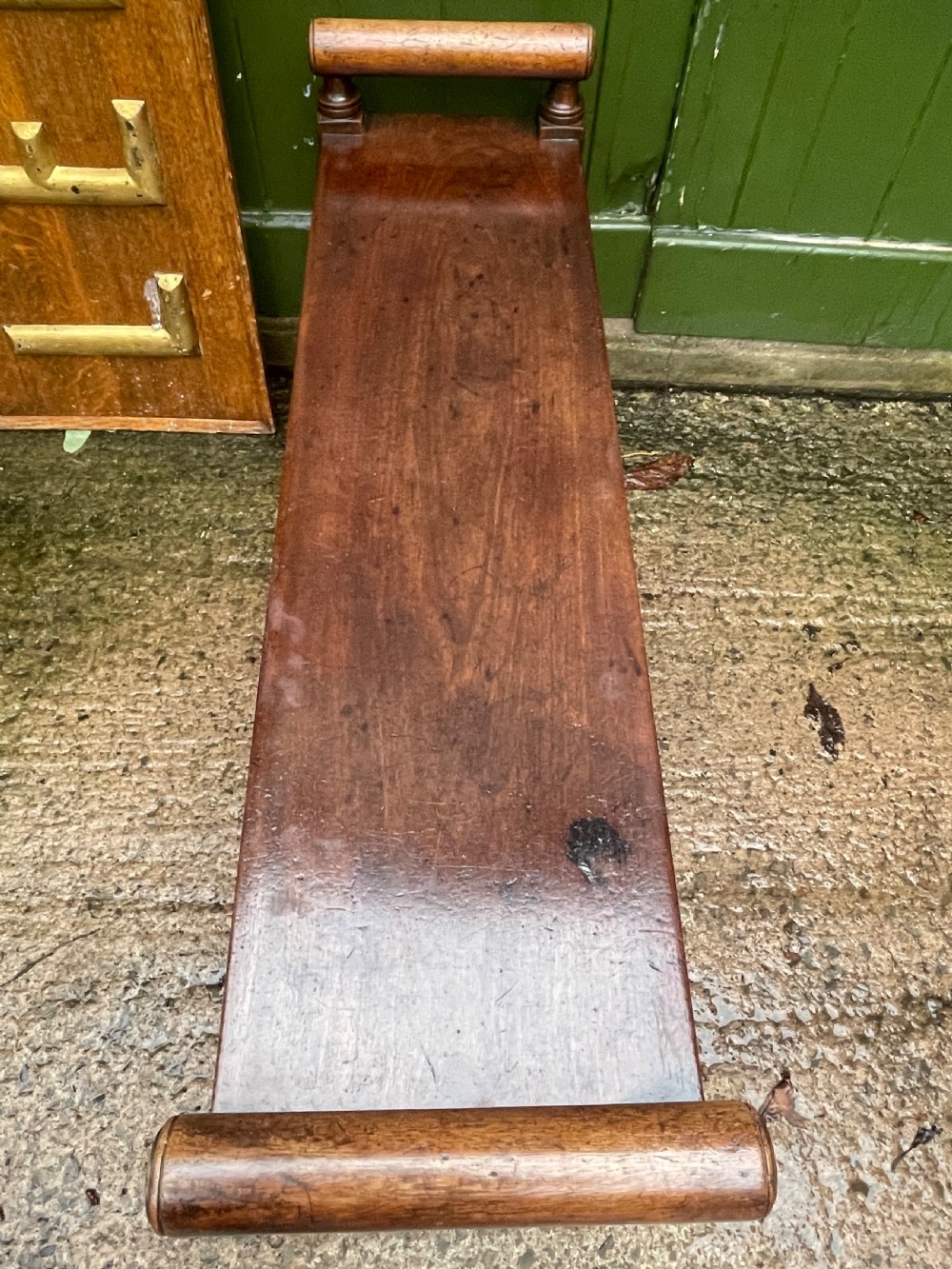 Early C19th Regency period mahogany hall bench or seat with cylindrical roll-end supports. View IX