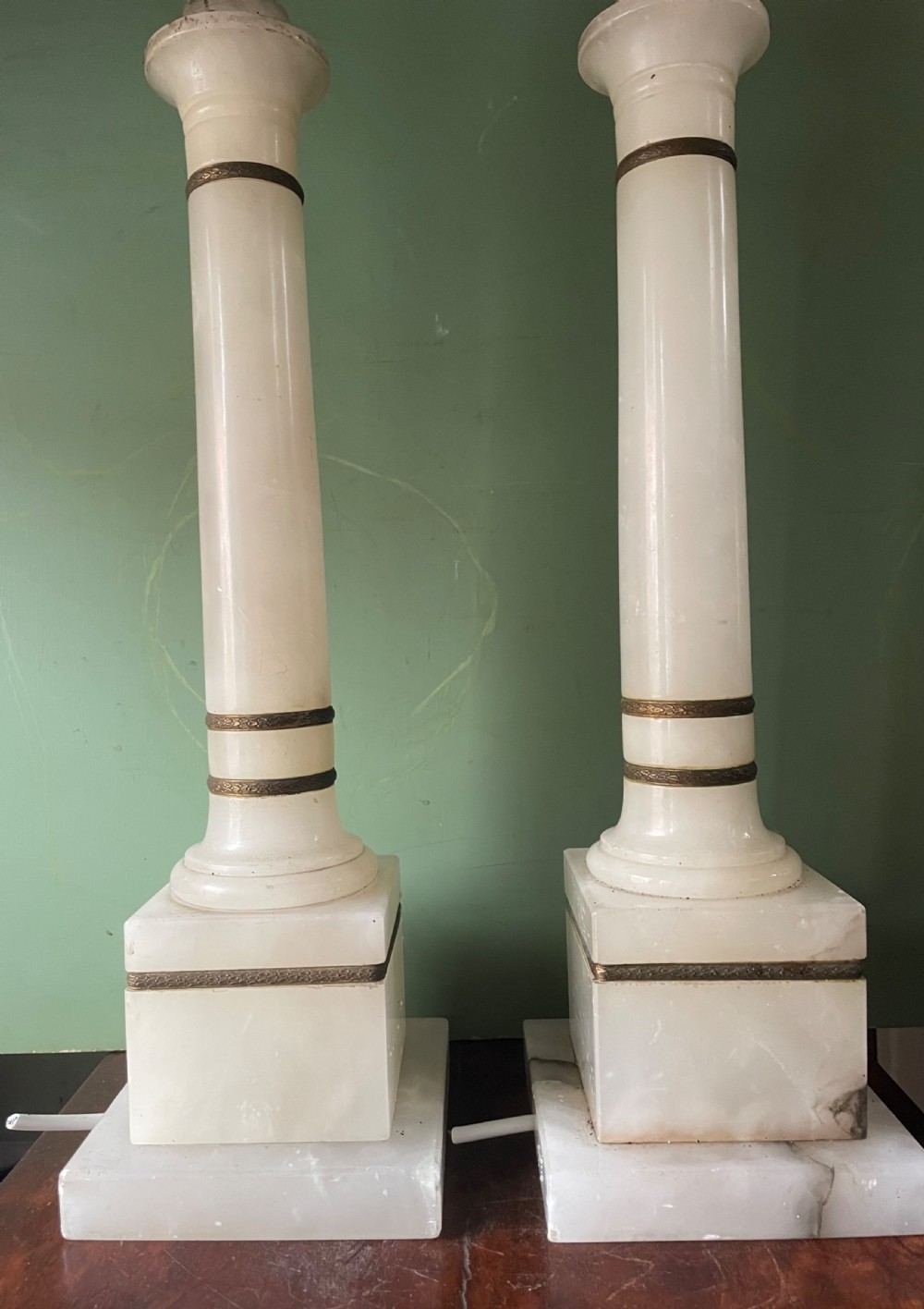 Pair of early C20th Italian gilt-brass mounted alabaster column table lamps . View III