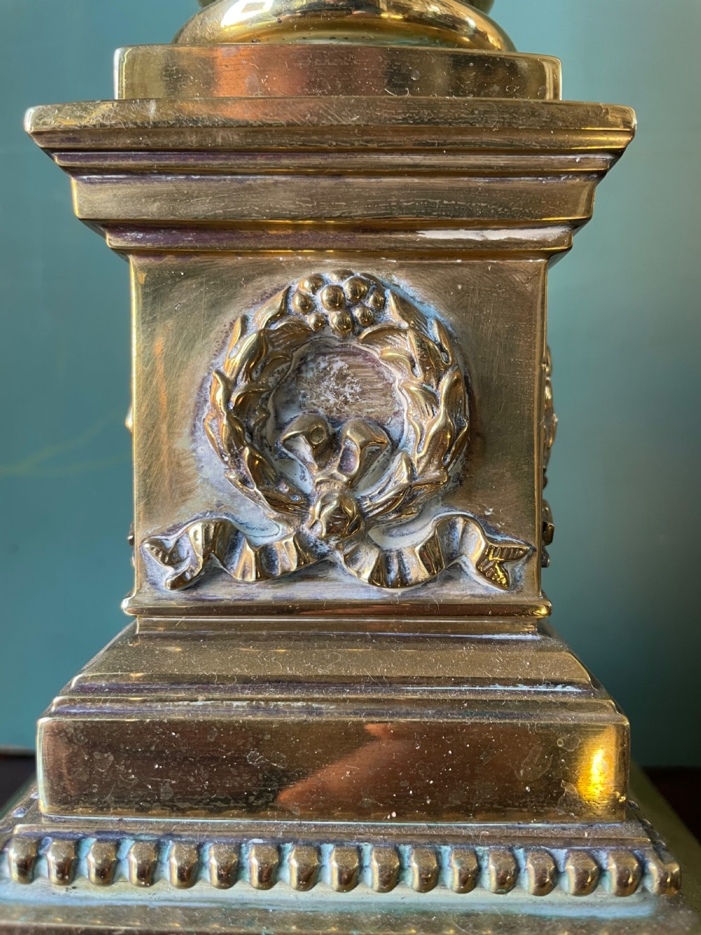 A late 19th-century brass table lamp styled as a classical fluted column with a stepped base and laurel wreath detail. View XV