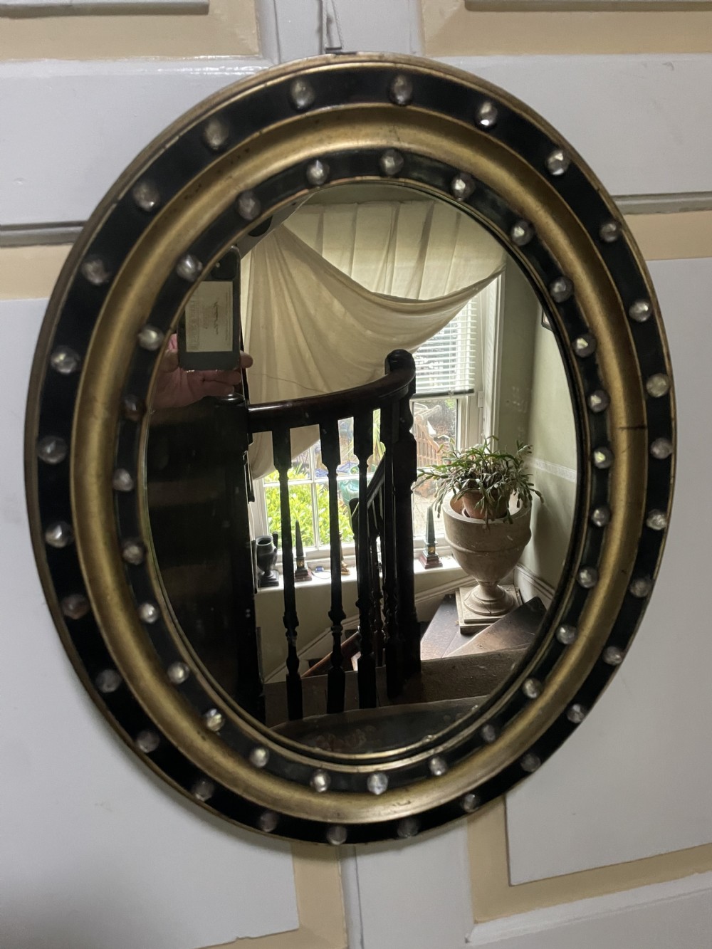 Mid C19th Irish oval mirror in ebonised and parcel-gilt moulded profile frame set with a double band of facetted cut-glass cabochons.  View X