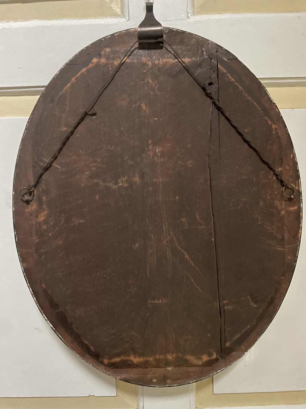 Mid C19th Irish oval mirror in ebonised and parcel-gilt moulded profile frame set with a double band of facetted cut-glass cabochons.  View XIII