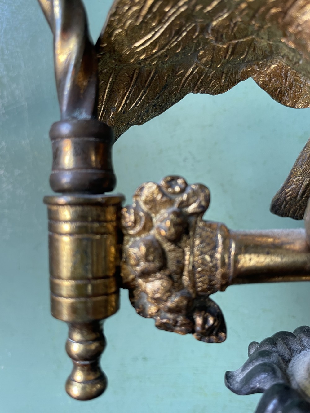 An early nineteenth-century Regency period three-light candelabra featuring adjustable swivelling arms, a central eagle figure perched above a fluted bronze column, and a square plinth base. View XXII