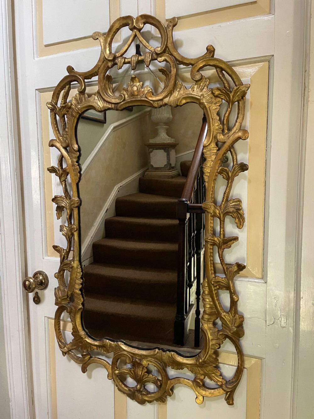 C18th George III Chippendale period carved gilt-wood frame rococo-style wall mirror.