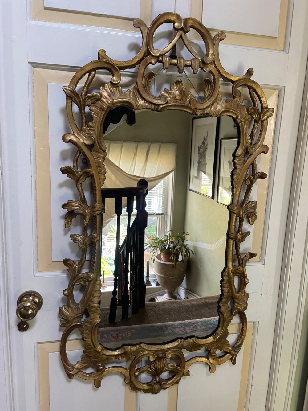 C18th George III Chippendale period carved gilt-wood frame rococo-style wall mirror. View II