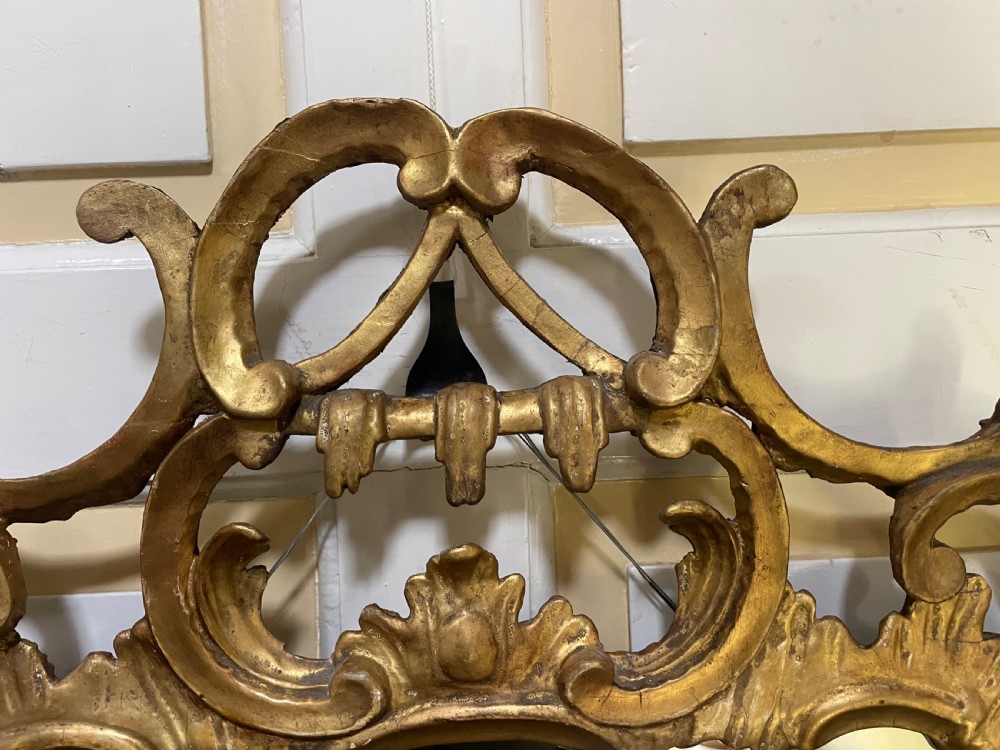 C18th George III Chippendale period carved gilt-wood frame rococo-style wall mirror. View VI