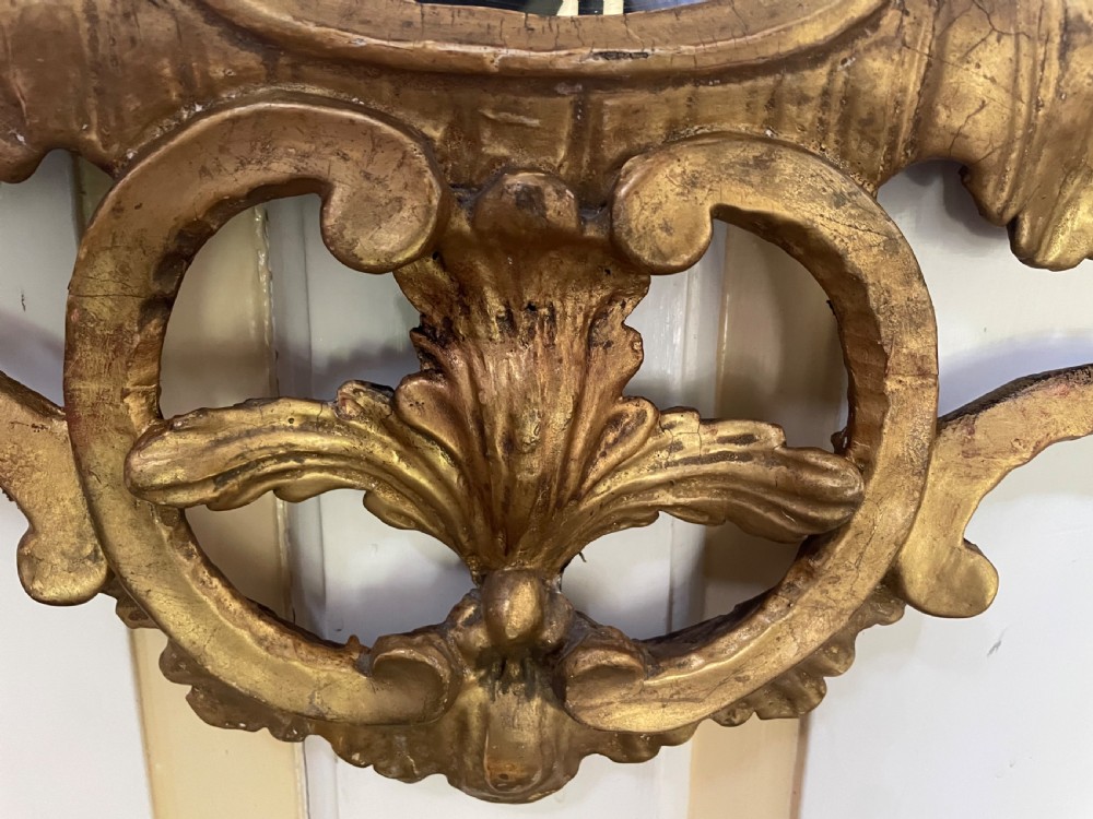 C18th George III Chippendale period carved gilt-wood frame rococo-style wall mirror. View VIII