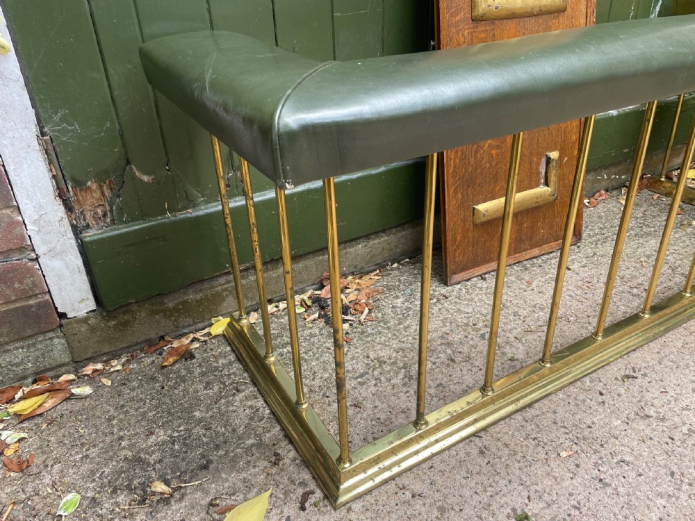 Early C20th Edwardian period polished brass and leather seated ‘club’ fender of restrained design. View III