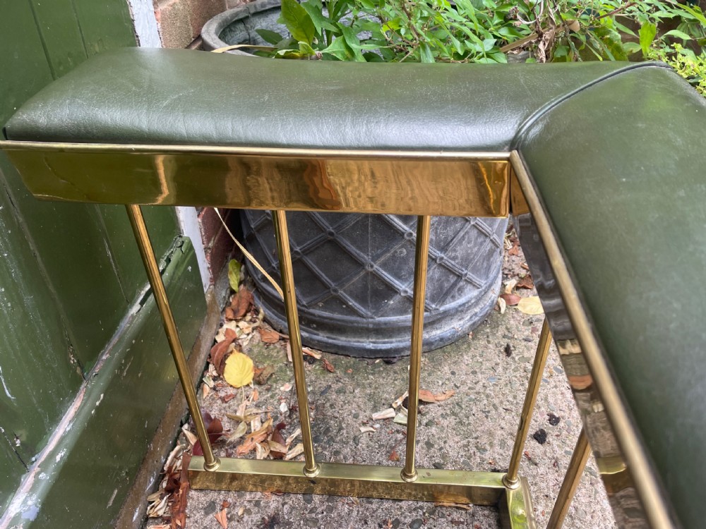 Early C20th Edwardian period polished brass and leather seated ‘club’ fender of restrained design. View X