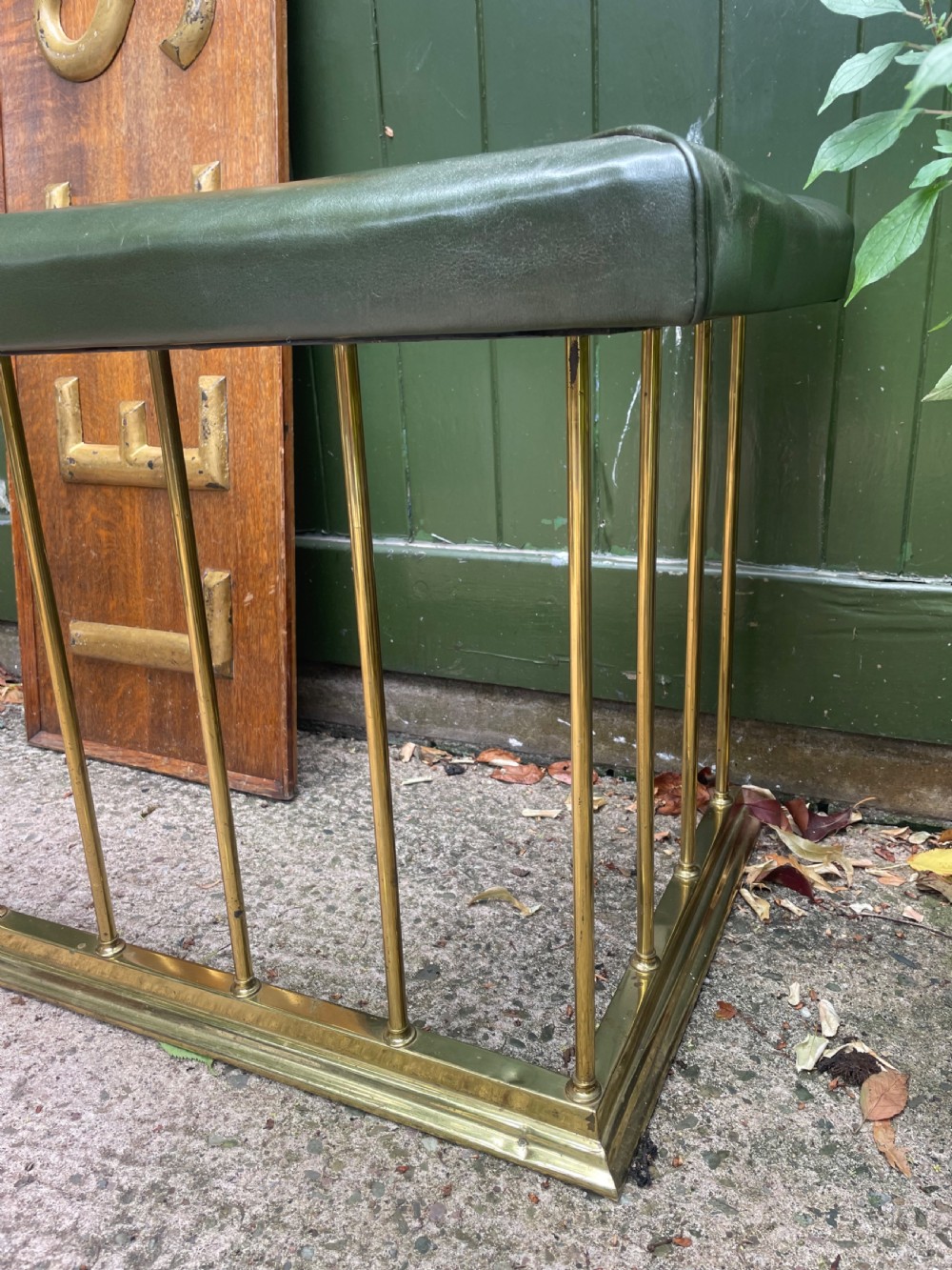 Early C20th Edwardian period polished brass and leather seated ‘club’ fender of restrained design. View XII