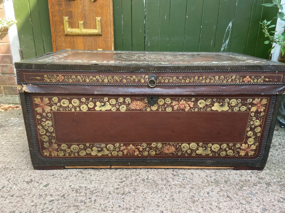 A 19th-century Chinese export leather trunk decorated with hand-painted gold and red floral motifs and brass stud borders. View II