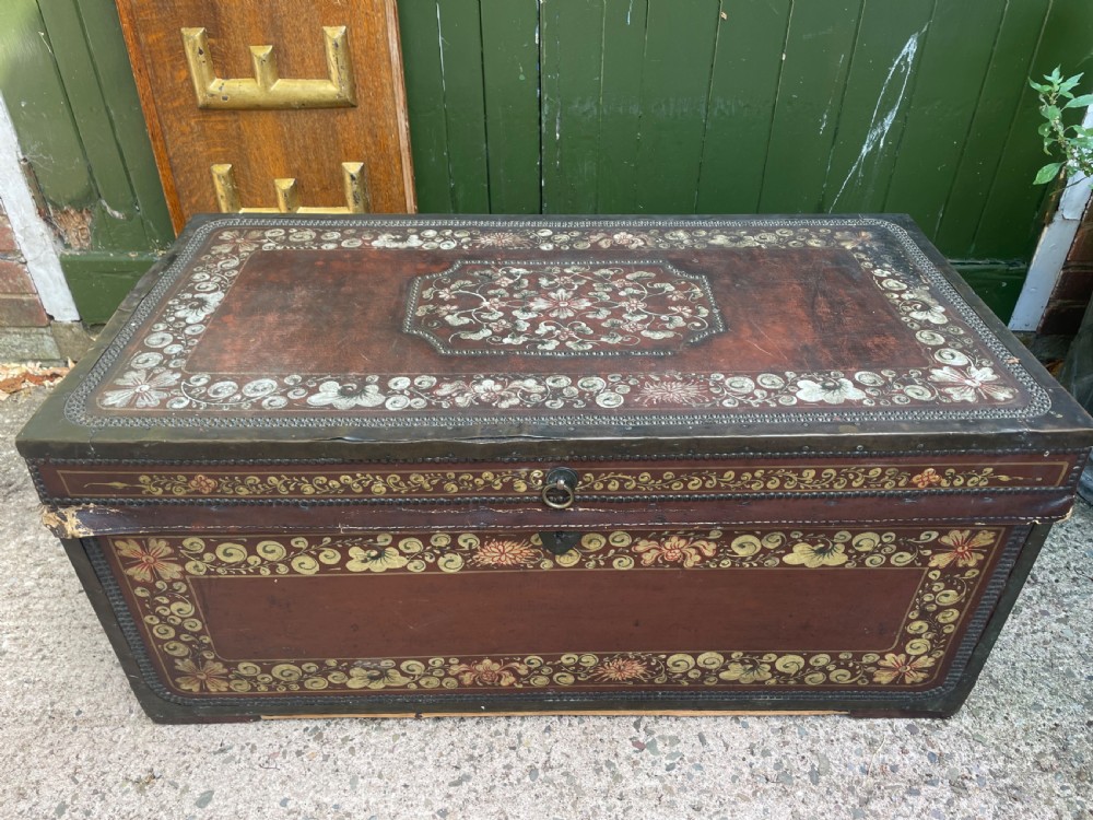 A 19th-century Chinese export leather trunk decorated with hand-painted gold and red floral motifs and brass stud borders. View III