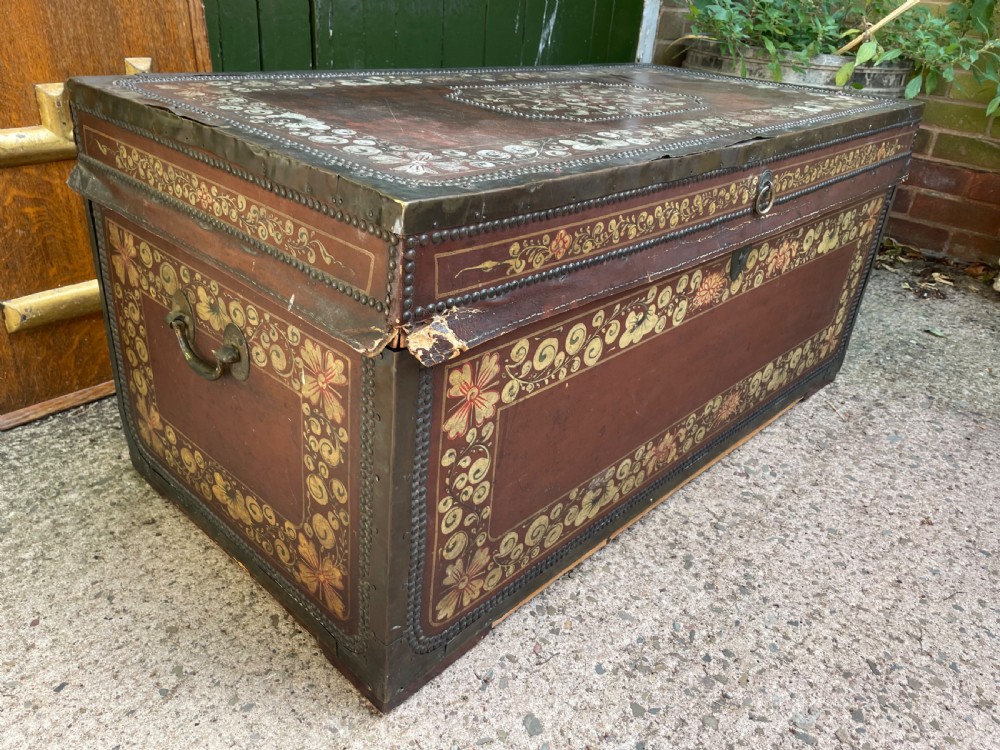A 19th-century Chinese export leather trunk decorated with hand-painted gold and red floral motifs and brass stud borders. View VI