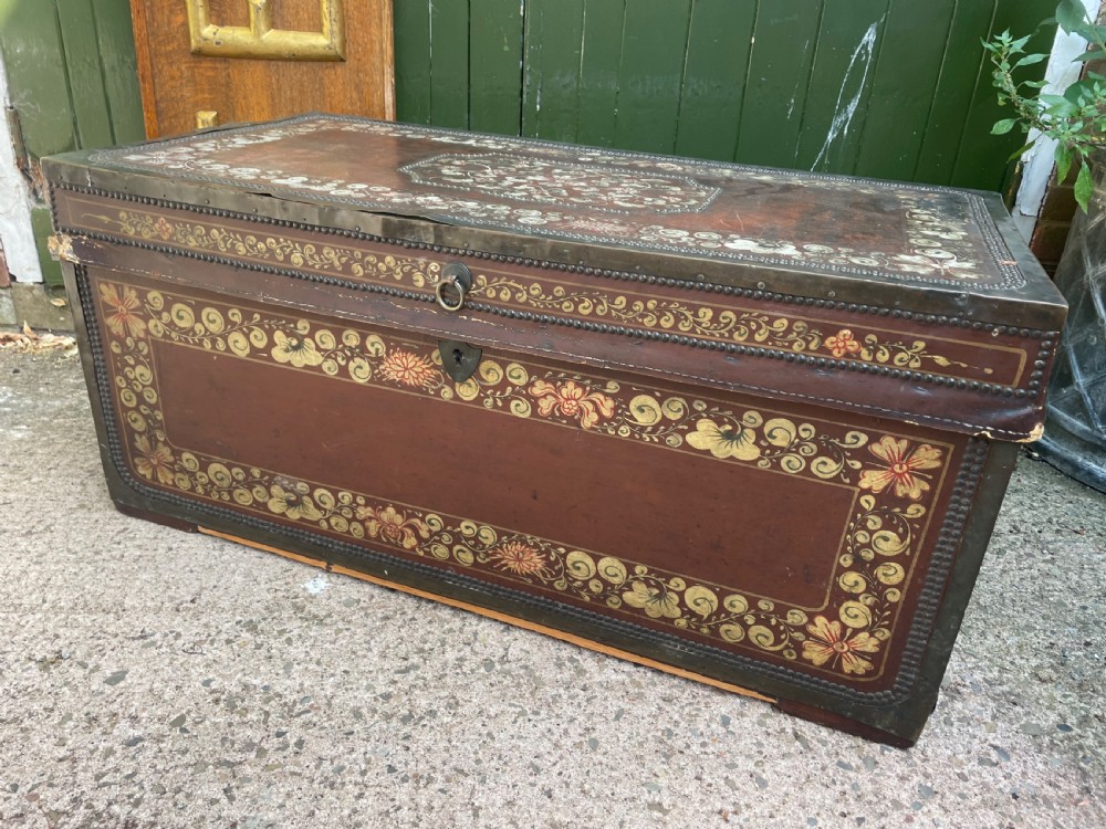 A 19th-century Chinese export leather trunk decorated with hand-painted gold and red floral motifs and brass stud borders. View IX