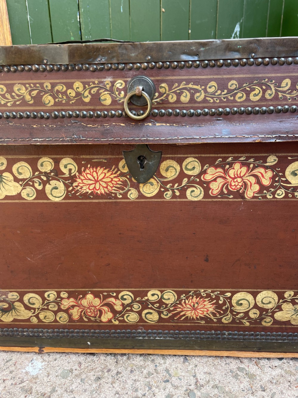 A 19th-century Chinese export leather trunk decorated with hand-painted gold and red floral motifs and brass stud borders. View XII