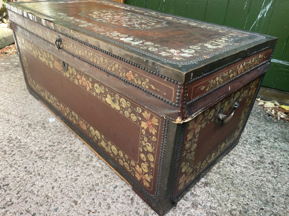 A 19th-century Chinese export leather trunk decorated with hand-painted gold and red floral motifs and brass stud borders. View XIV
