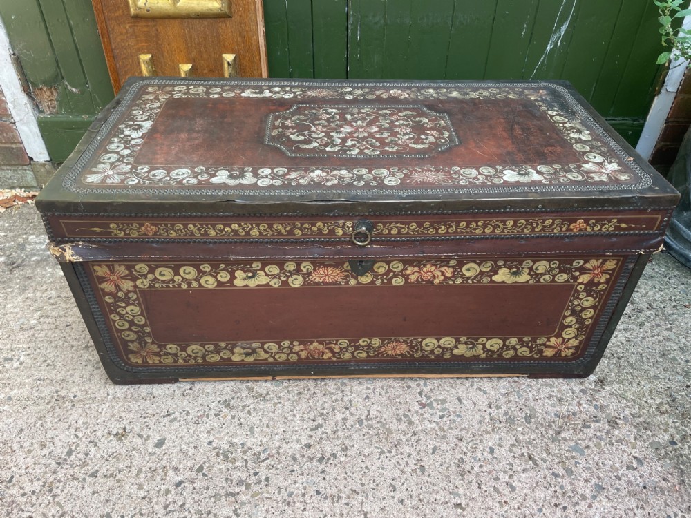 A 19th-century Chinese export leather trunk decorated with hand-painted gold and red floral motifs and brass stud borders. View XXI