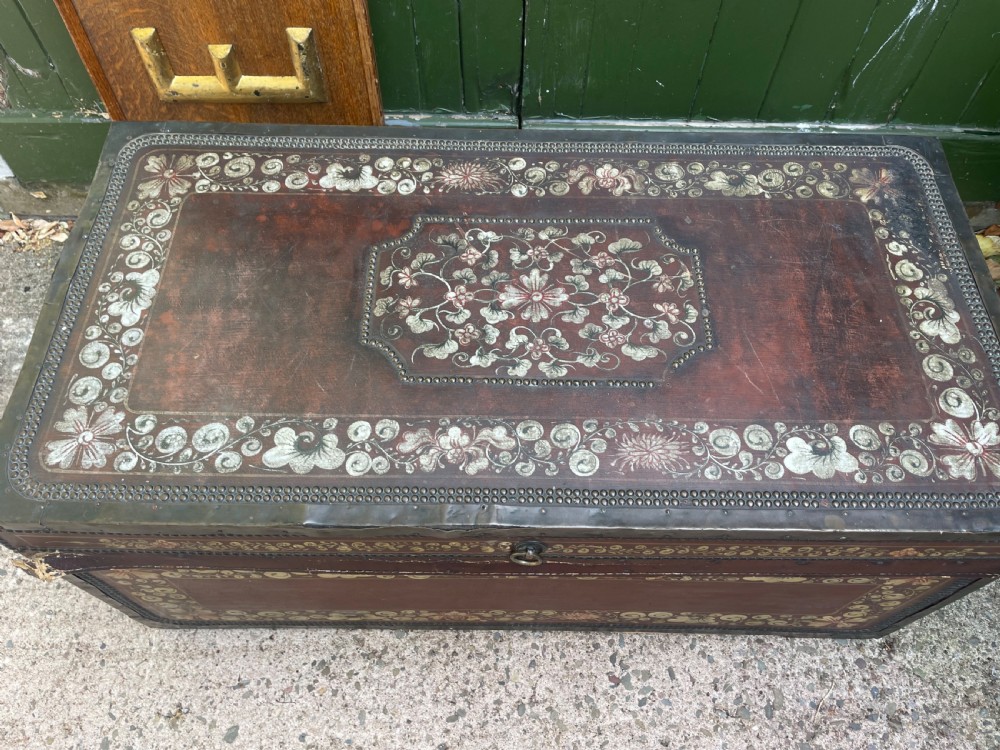 A 19th-century Chinese export leather trunk decorated with hand-painted gold and red floral motifs and brass stud borders. View XXII