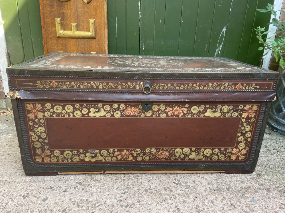 A 19th-century Chinese export leather trunk decorated with hand-painted gold and red floral motifs and brass stud borders. View XXIII