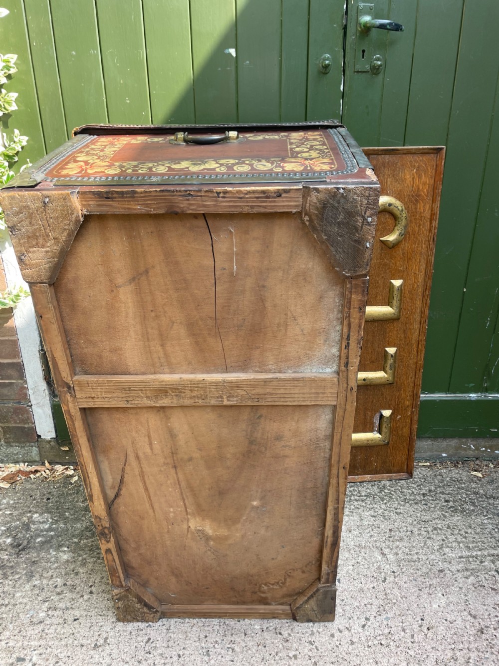 A 19th-century Chinese export leather trunk decorated with hand-painted gold and red floral motifs and brass stud borders. View XXIV