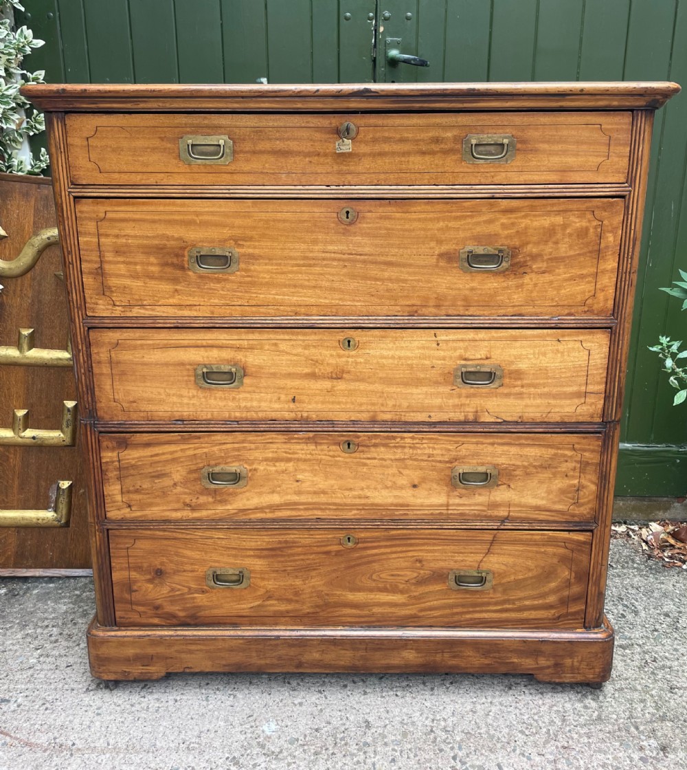 A nineteenth-century two-section camphorwood military campaign chest of drawers with flush brass handles and keyhole escutcheons. View II