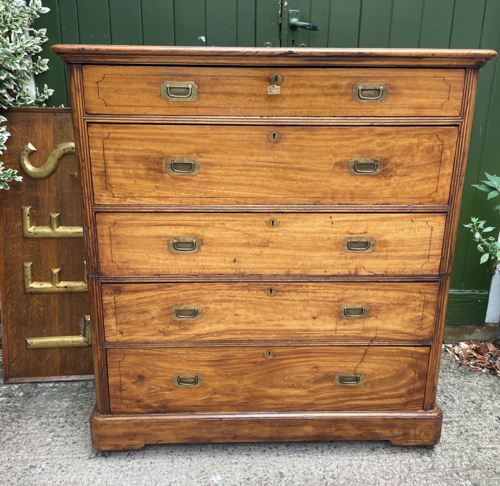A nineteenth-century two-section camphorwood military campaign chest of drawers with flush brass handles and keyhole escutcheons. View III