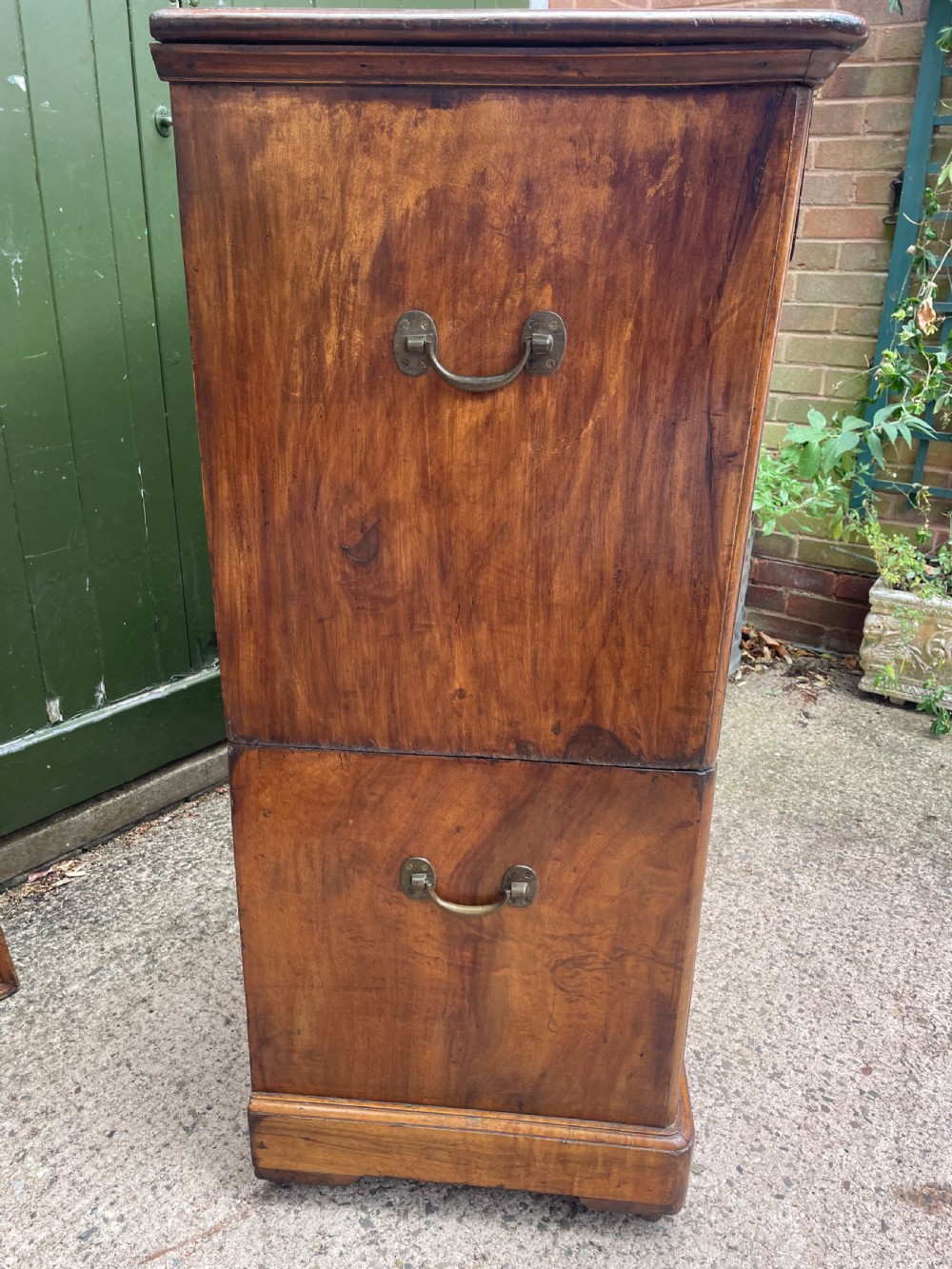 A nineteenth-century two-section camphorwood military campaign chest of drawers with flush brass handles and keyhole escutcheons. View XV