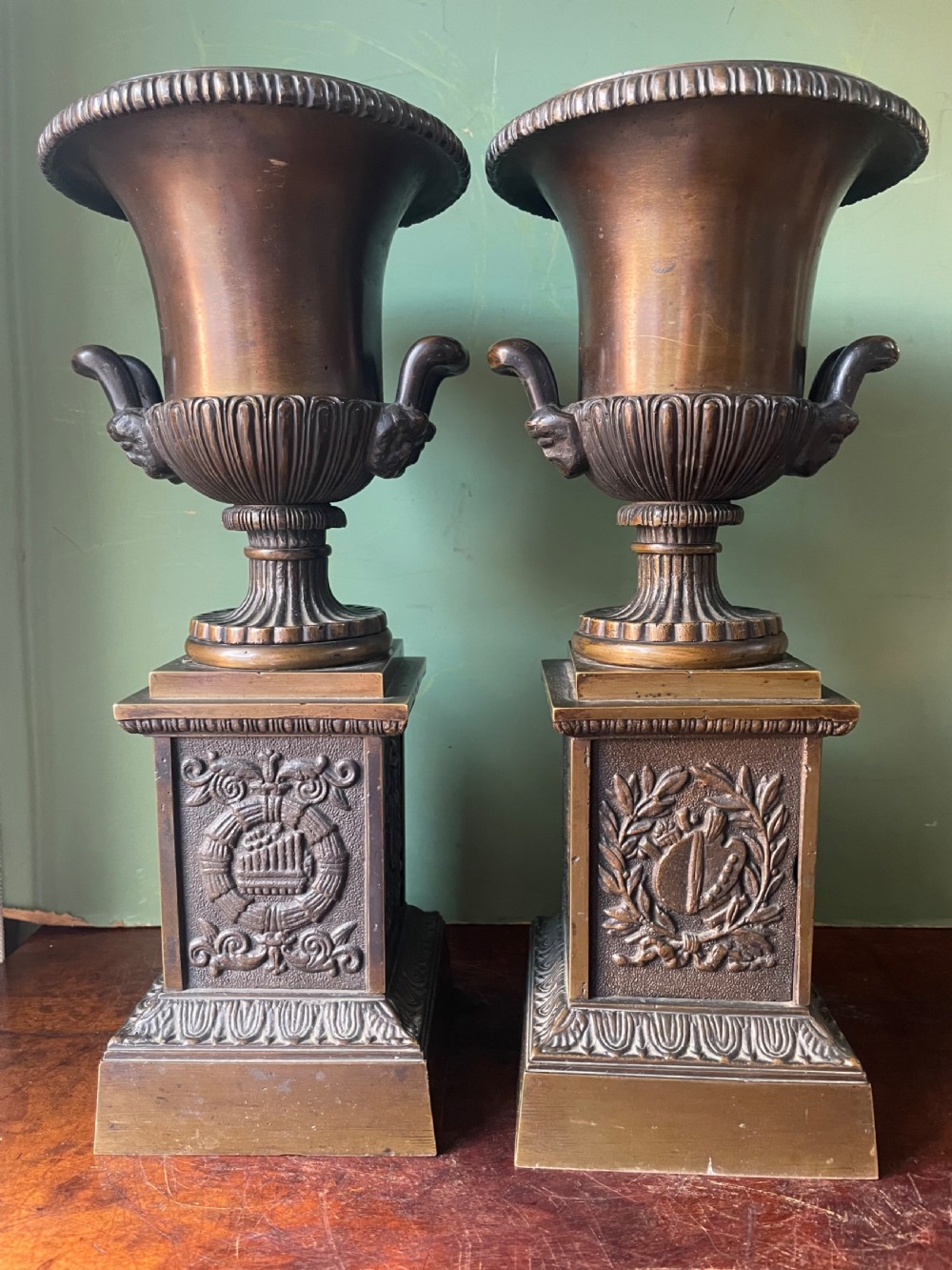 Pair of early C19th French Charles X period campana-shaped classical style bronze urns .